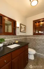 Full tile bath with heated floors on upper level.