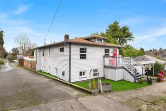 Sunny, level corner lot. Hard to find in Seattle! Grass in photo is digitally enhanced.