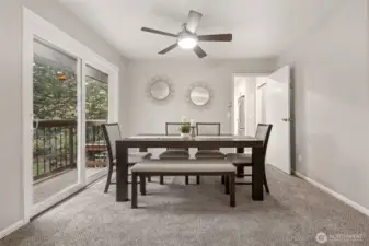 The formal dining area is just off the kitchen, and located perfectly next to French doors and the viewing deck.