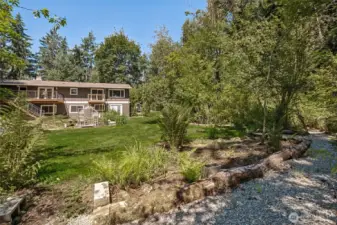Lawn, walkways, creek and all the mature native growth makes this property so  flexible. Throw a soiree or stay super quiet and enjoy the peace. Plenty of room to do it all!