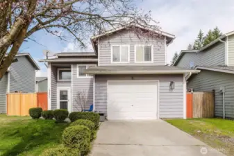 Welcome home!  Front of house faces the south so you have all day natural light through all the front windows.  Boxwood hedge lines the driveway and leads up to the front door.