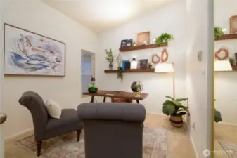 The third bedroom is staged out as an office space. Mirrored closet doors provide a convenient full-length mirror, combining style and functionality in one sleek design.