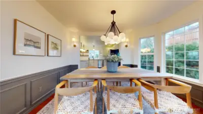 Dining room with wainscoting and bay window