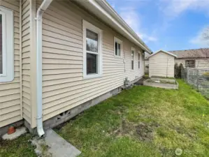 Shed in backyard along with planters