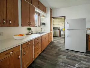 Plenty of cabinet space, dishwasher in the pantry area along with newer electrical panel and new hot water tank.