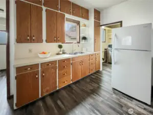 Floor installed in 2021 in kitchen and brand new refrigerator.