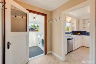 Backdoor entry mudroom with laundry.