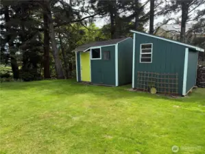 Outbuildings for different purposes, one for lawn care equipment and the other for storge and beach toys. materials.