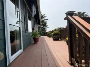This composite wrap-around deck is low maintenance and great entertainment.        The \\