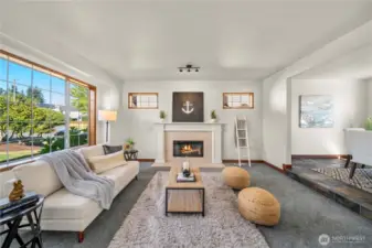 Formal living room w/ cozy fireplace