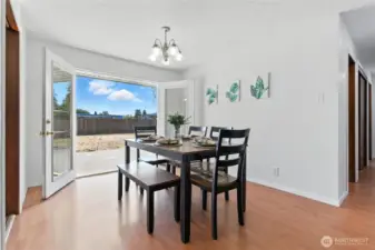 Dining room with beautiful French doors leading to the fully fenced backyard
