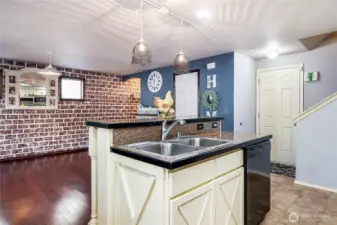 Sweet country "brick" wall is quaint and adds  to that country feel - but is just paint and can be easily repainted to match your own decor!