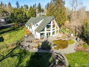 3 patios on south side of the home  Aggregate concrete walkway wraps around ¾ of the house.