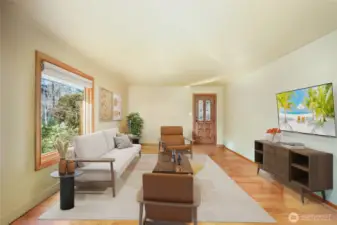 Living Room  Beautiful hardwood floors with 5-1/2” painted baseboard trim. Virtually staged