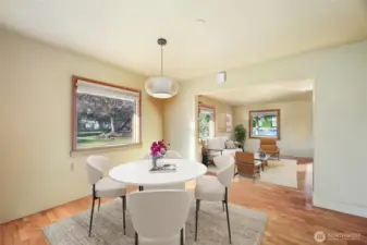 Windows overlooking front and side yards. Virtually staged.