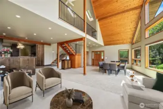 Custom storage cabinets under open staircase and on peninsula  Large storage cubby under stairs / Closet  Virtually staged