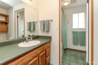 Main bathroom with private shower room.