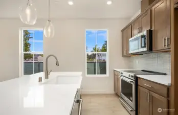 Kitchen and Island with farmhouse sink