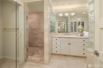 This shower space is gigantic! The whole family could clean up in this shower area.