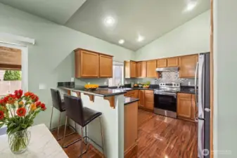 Kitchen open to Family Room w/ Vaulted Ceilings