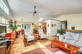 Living area looking towards the dining area and kitchen. Hickory floors throughout.
