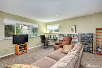 This is a grand room. It has enough sq. footage for large couch, office area and bedroom to the right.