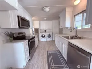 Updated kitchen with stainless steel appliances and like new washer and dryer.