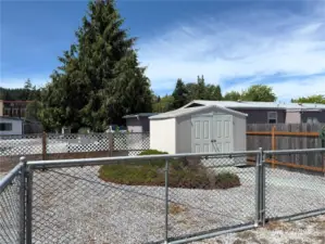 Oversized back yard is fully fenced with additional double door shed for all your tools!
