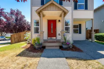 Craftsman charm with a covered entry welcomes you to come on in.