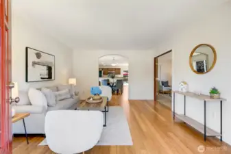 Entry into living room. Sight line to the back of the home.