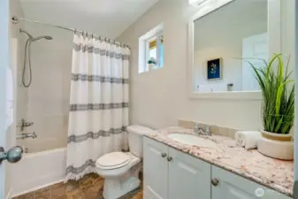 Top of the stairs, full bathroom.