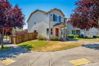 Lake Stevens Pasadera 4 bedroom on a corner lot. Driveway parking. Exterior washed, covered entry restained, deck painted, fresh entry pots add to the curb appeal.