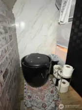 Indoor Porta Potty. Heavy and solid, wont tip over! Use a liner bag, and camping toilet powder to gels. Or honestly, kitty litter works great too and is much cheaper.