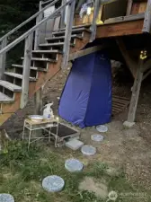 Outdoor sink station and shower