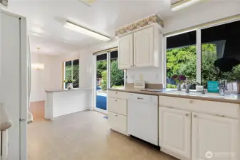 Kitchen has slider to back yard. Imagine doing the dishes and enjoying the view to the backyard. Possible eating bar or desk separates the dining area.