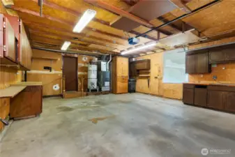 2 car garage with storage and work benches.