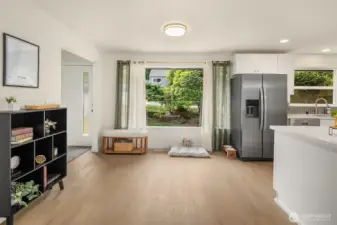With tons of Natural Light & Gorgeous LVP Floors