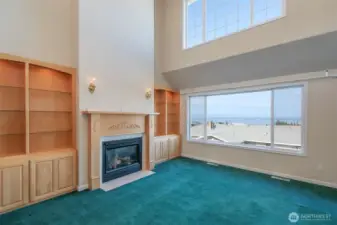 Living Room with built-in s and propane fireplace.