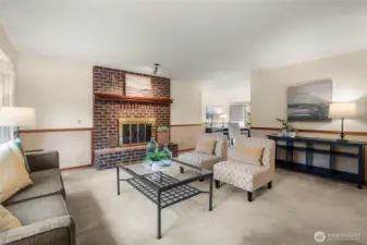 Living room w/fireplace flows into dining room