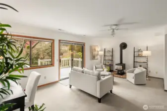 Rec room w/access to 2 car garage, 1/2 bath, laundry & slider to lower deck