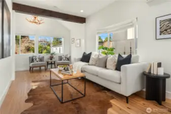 A soaring vaulted ceiling is just off the living room with an abundance of windows bringing in the natural light.