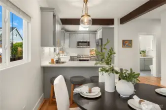 Just off the end of the updated kitchen is a breakfast bar that seats 3 comfortably.