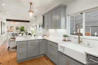 Quartz counters and an undermount farmhouse sink give this kitchen a sleek but charming look.