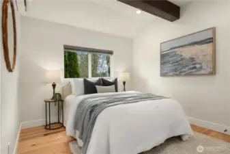 The second bedroom also lives large and maintains the designer elements.