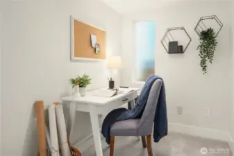 Just downstairs is this comfortable office niche just outside the rec room or possible third bedroom.