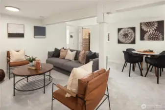 The rec room has an internal door separating it from the office area as well as an external door to the side of the house.