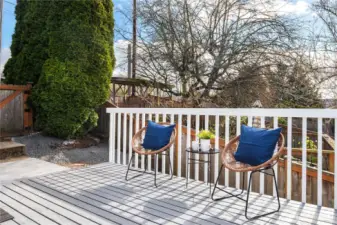 Just off the upper parking area is the side entrance and this sunny deck.