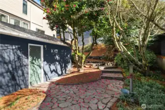 With the garage on the left we are looking at the flagstone path that meanders up to the house.