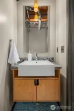 Powder room off the living & kitchen level.