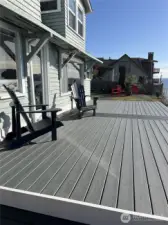 Brand new composite deck with plenty of space for a large dinner party and only feet away from the lapping water.